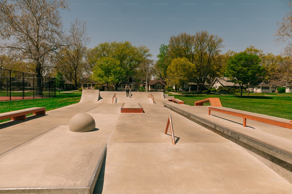 a group of skateboard ramps in a park