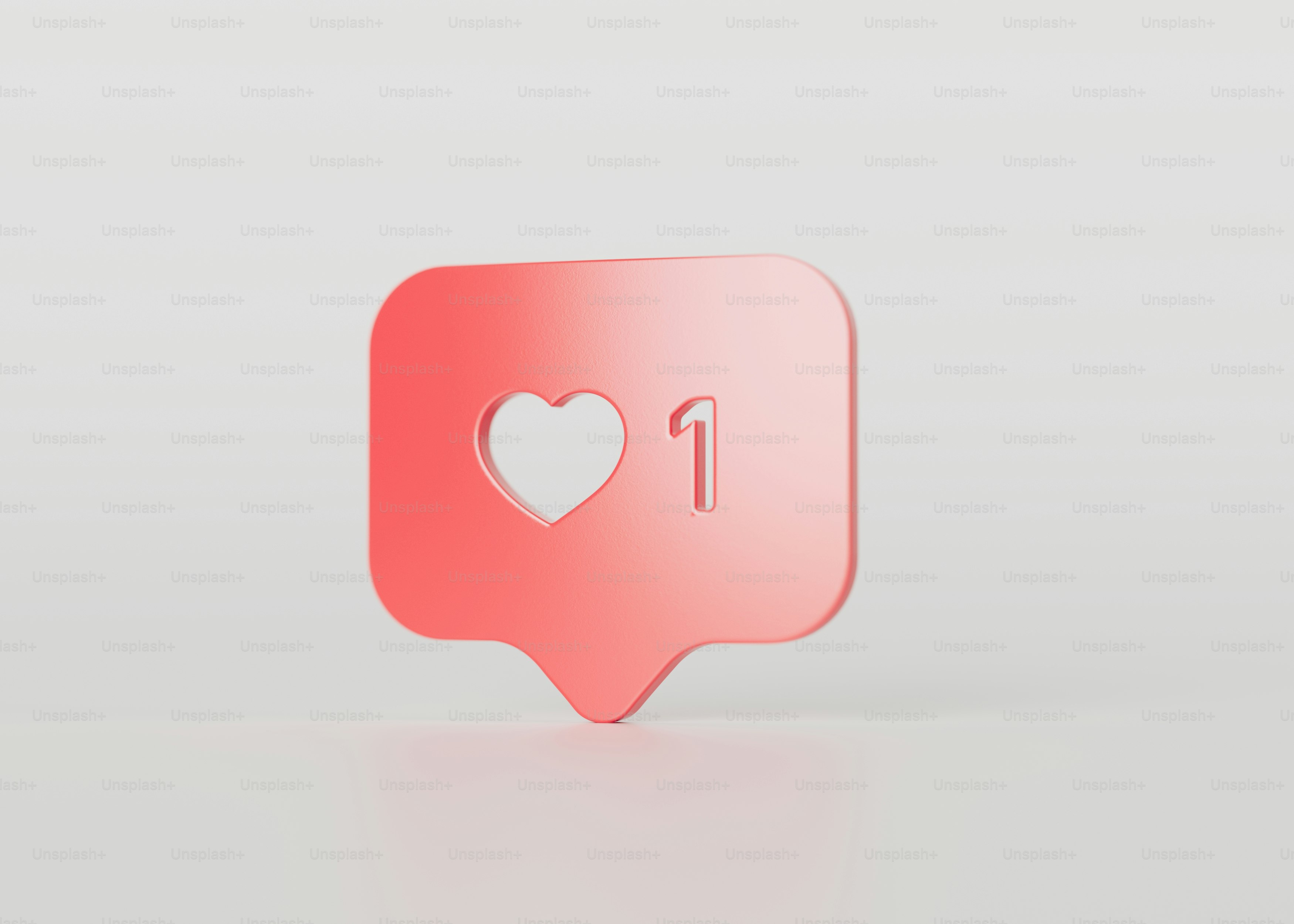 a pink speech bubble with a heart on it