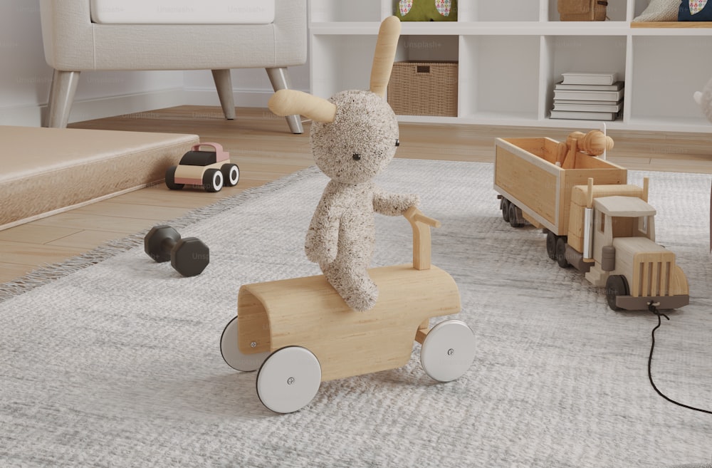 a stuffed animal on a toy car in a child's room