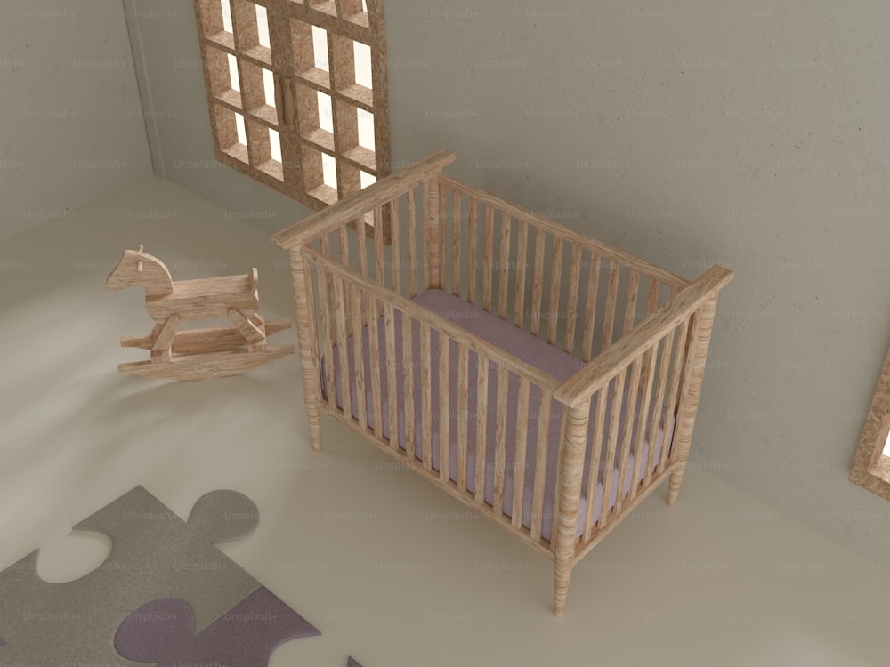 a baby crib with a wooden rocking horse next to it