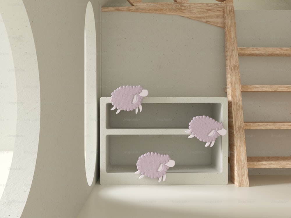 a room with a ladder and three pink hedgehogs