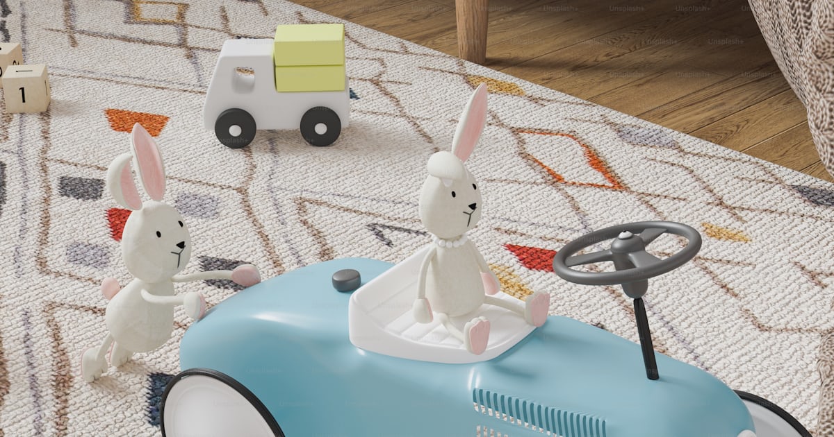 A blue toy car with two rabbits in it photo – Animation Image on Unsplash