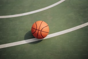 a basketball sitting on top of a basketball court