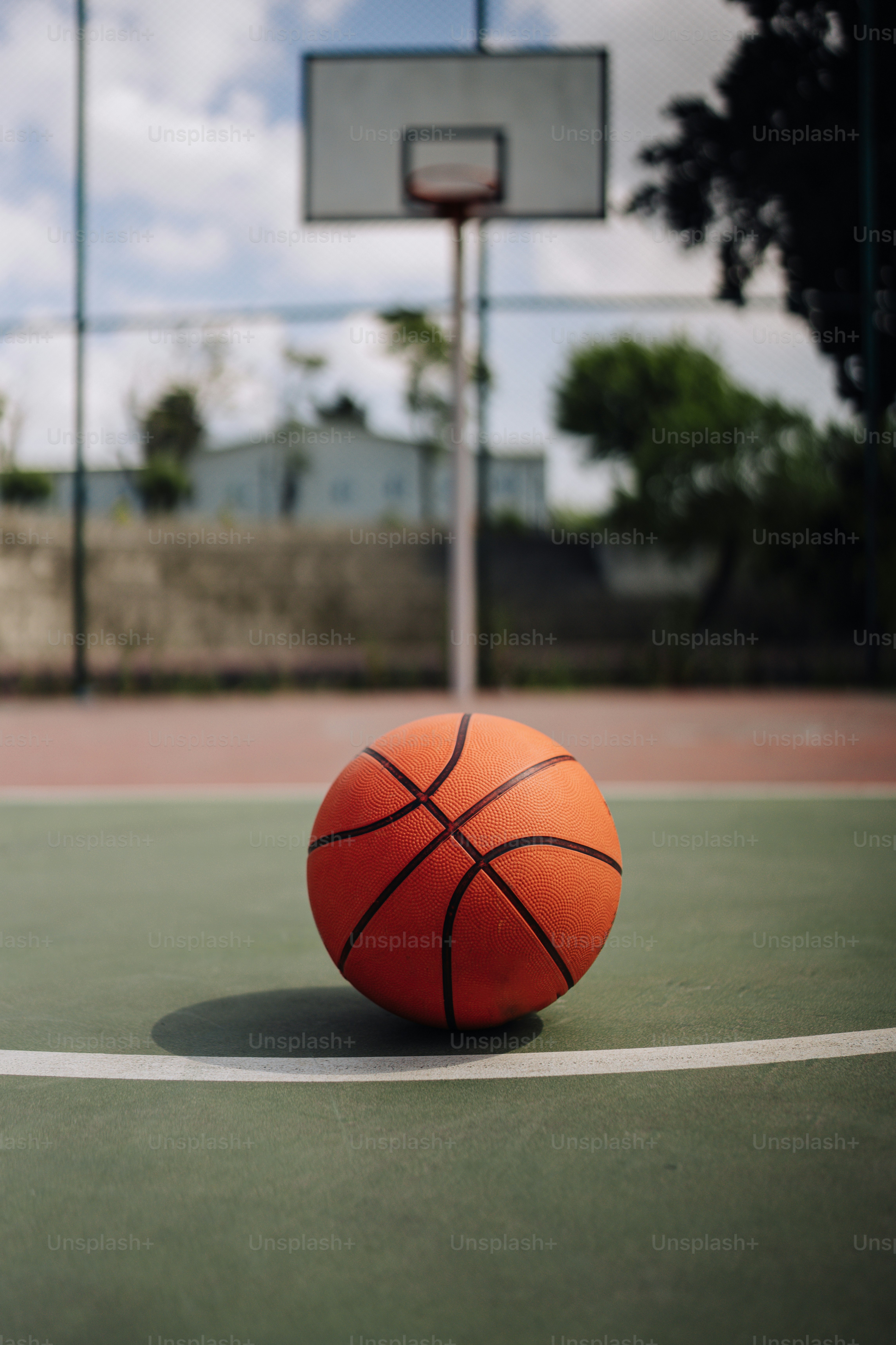 a basketball sitting on top of a basketball court
