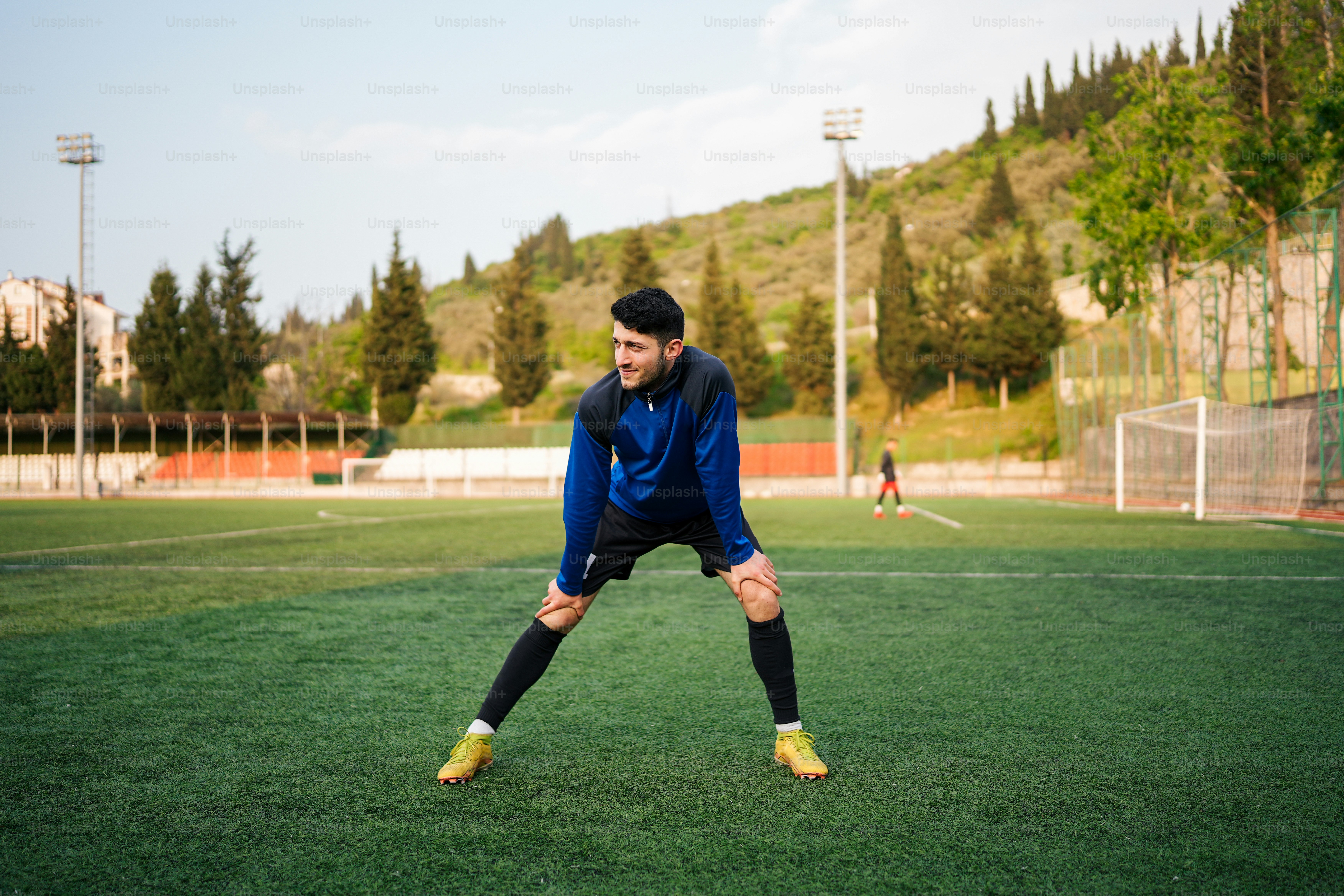 a man standing on top of a soccer field