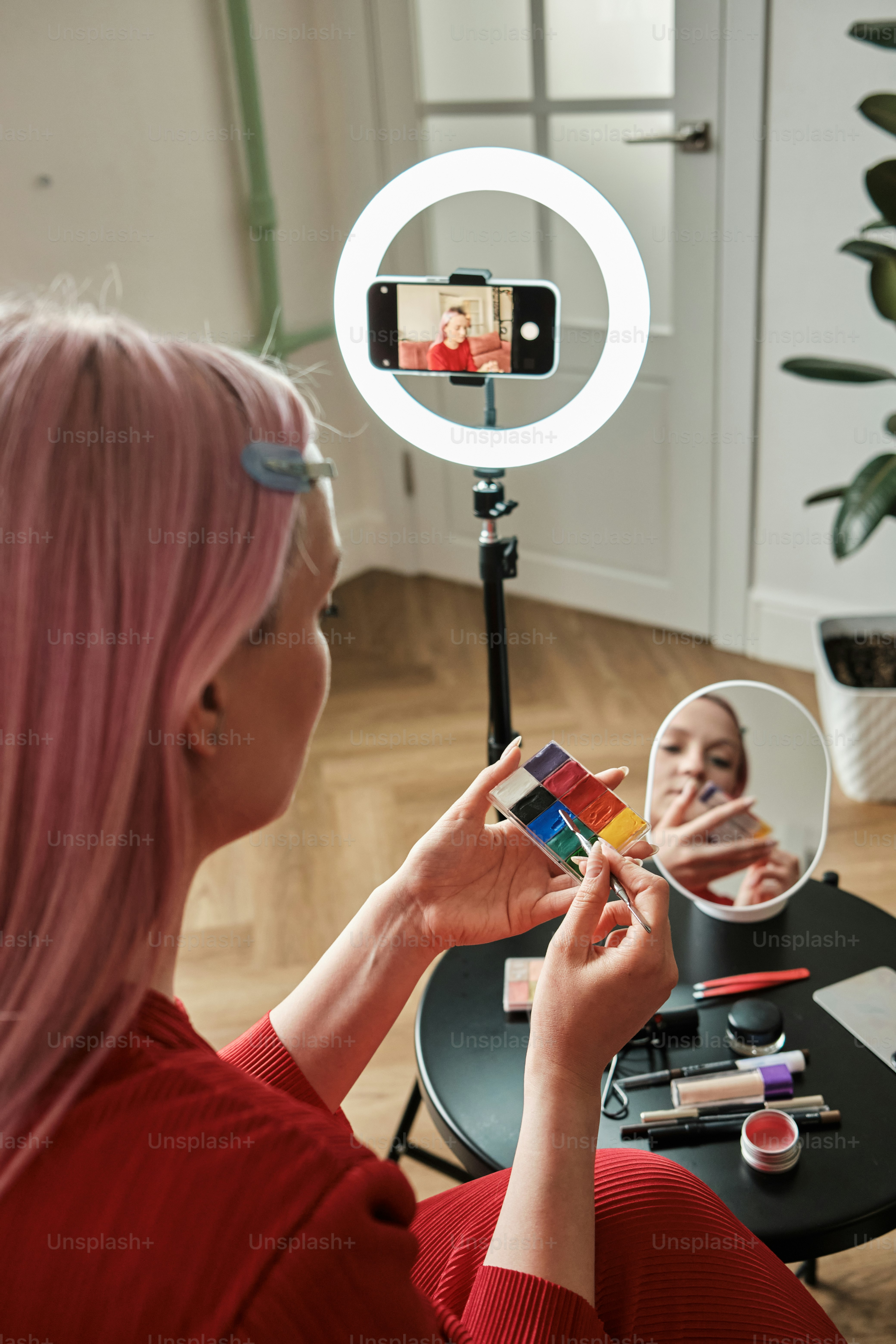 a woman taking a picture of herself in a mirror