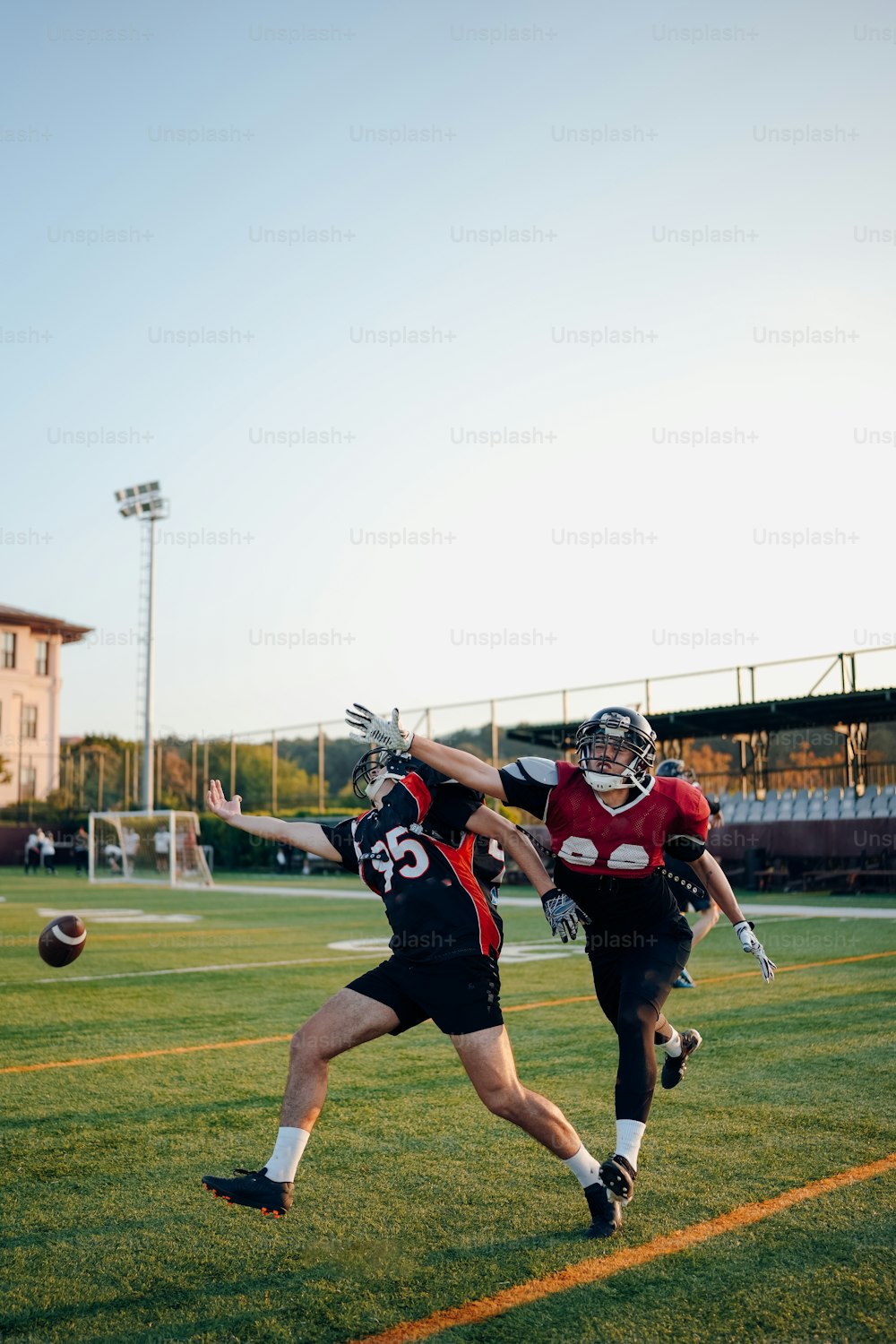 a couple of men playing a game of frisbee on a field