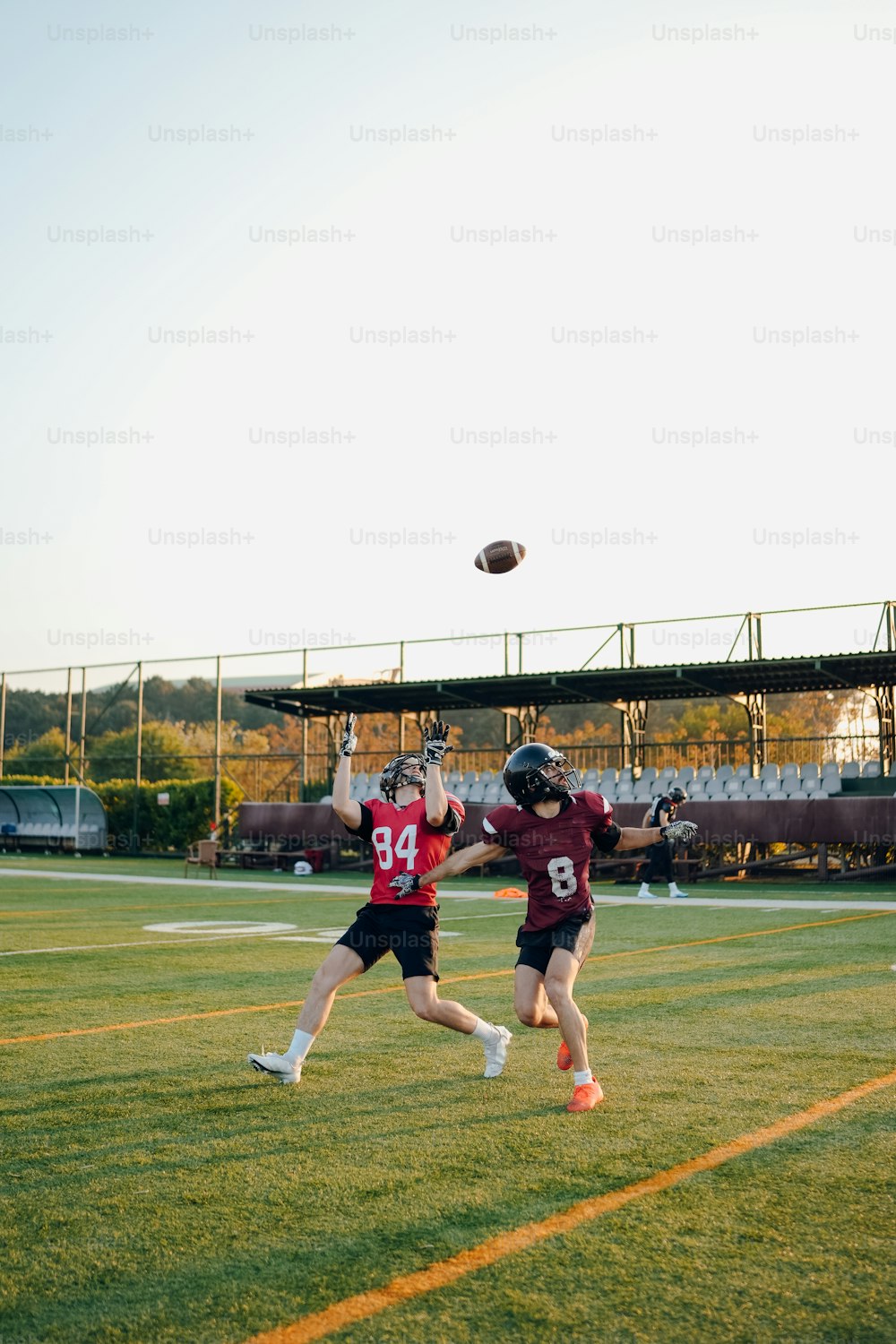 a couple of people on a field playing frisbee