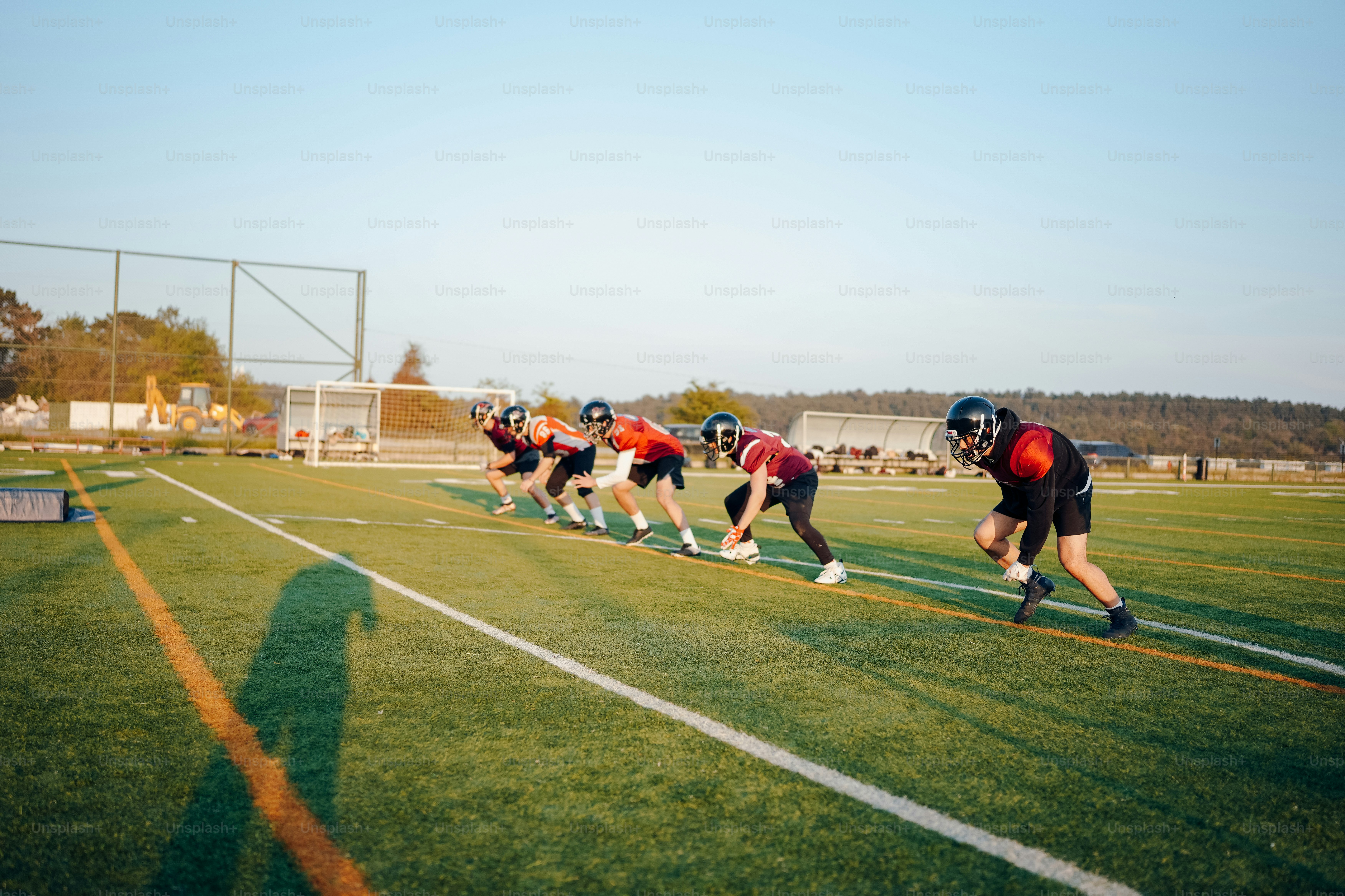 a group of people on a field playing football