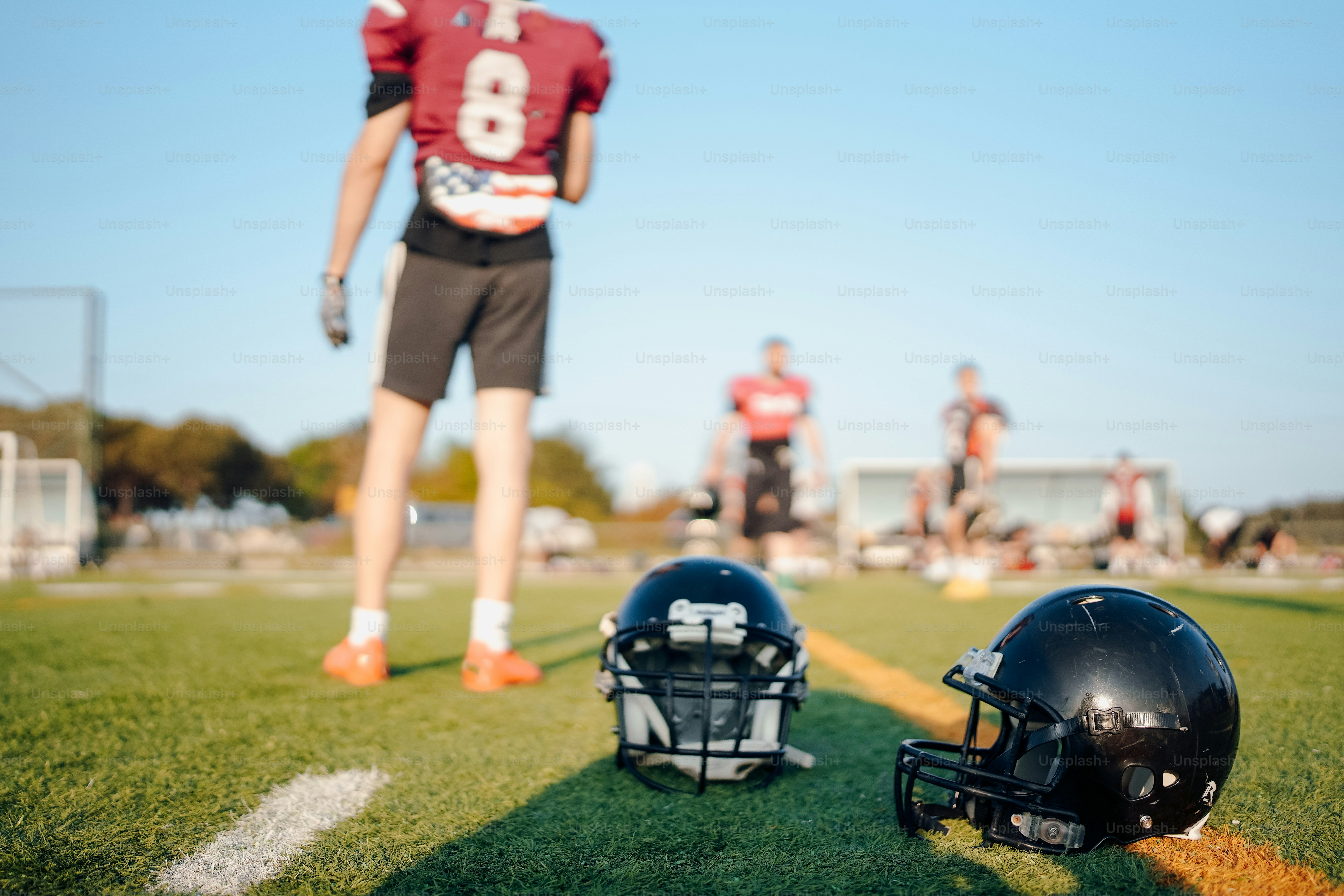 A football helmet and helmet on the field photo Football helmet Image on Unsplash