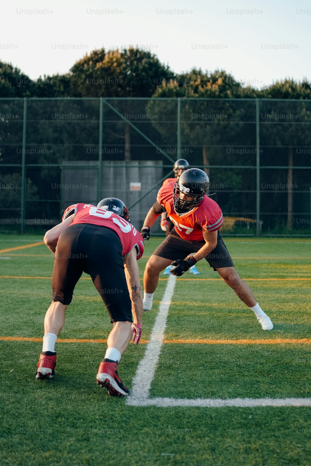 a group of men playing a game of frisbee on a field