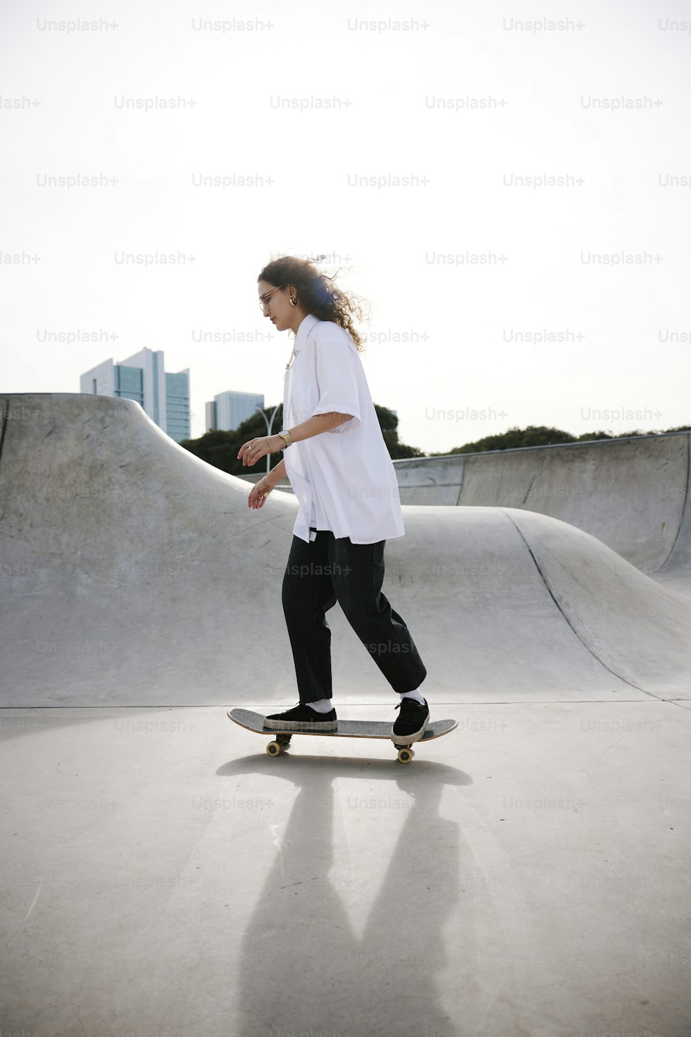 a person riding a skate board on a ramp