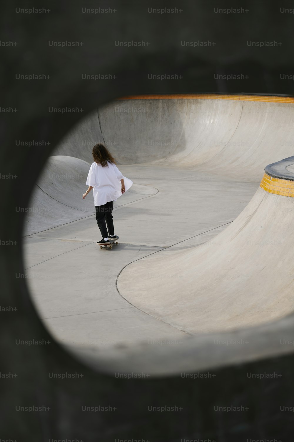 a person riding a skateboard at a skate park