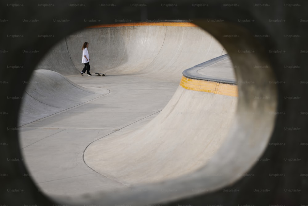 a person riding a skateboard at a skate park