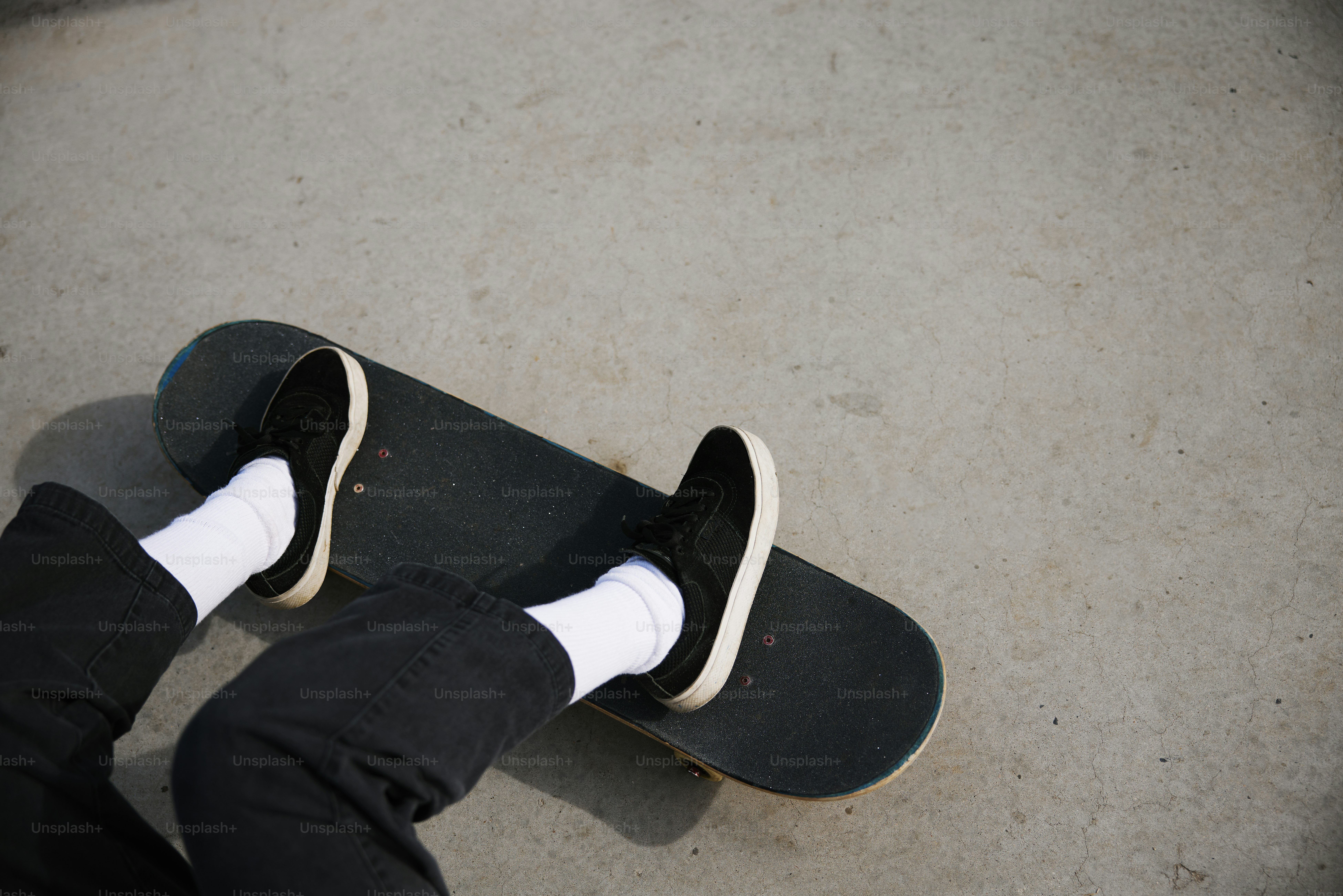 a person with their feet on a skateboard