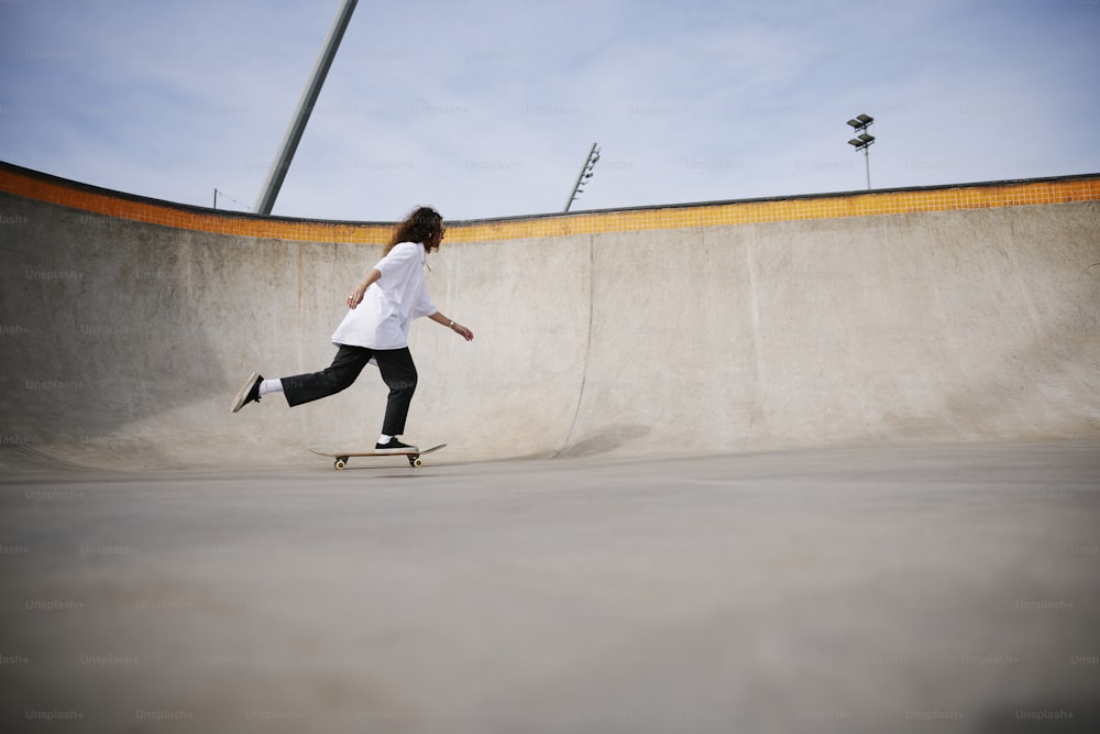 a person riding a skateboard in a skate park