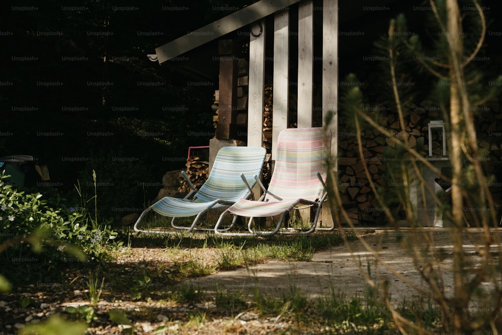 a couple of lawn chairs sitting next to each other