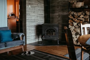 a living room with a chair and a fire place