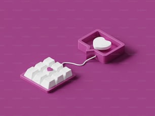 a computer mouse connected to a keyboard on a purple surface