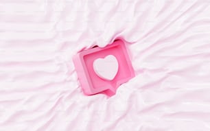 uma caixa rosa com um coração branco nela
