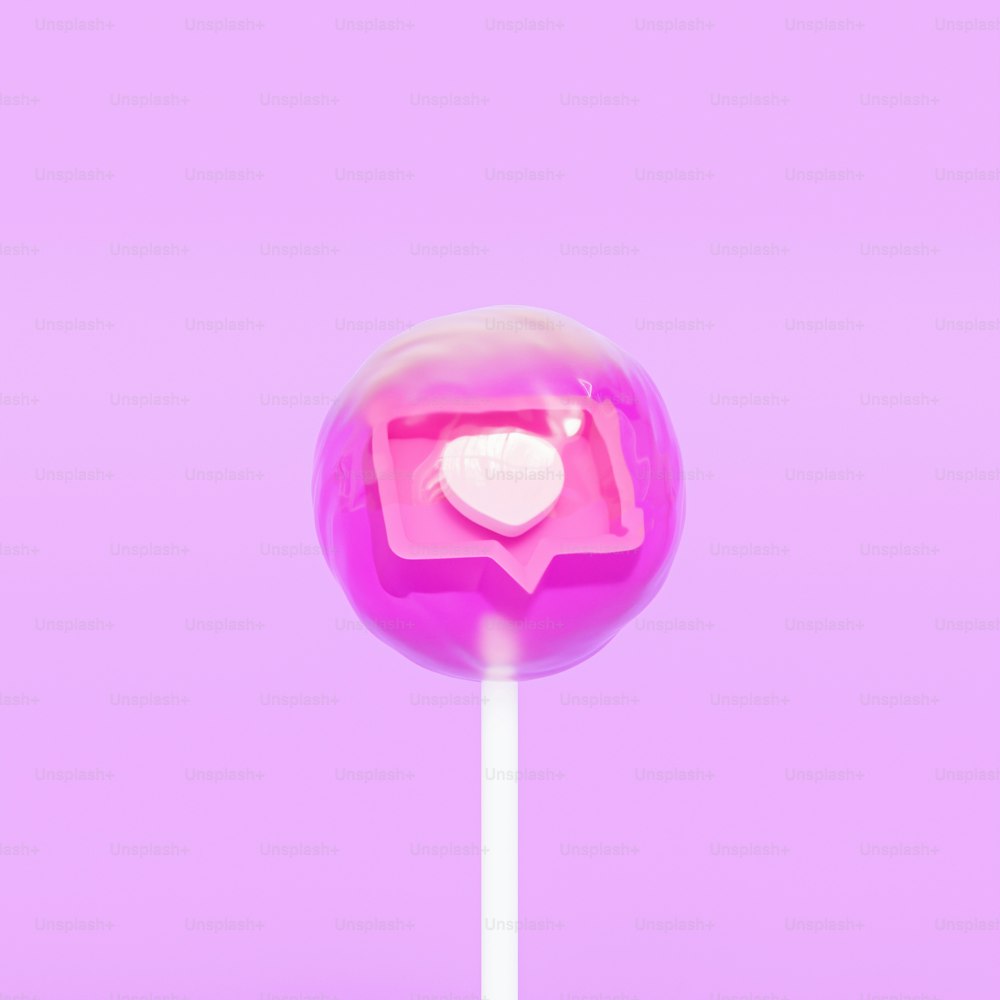 하트가 그려진 핑크색 막대 사탕