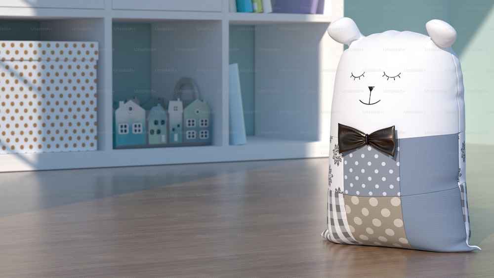 a stuffed animal with a bow tie sitting on a table