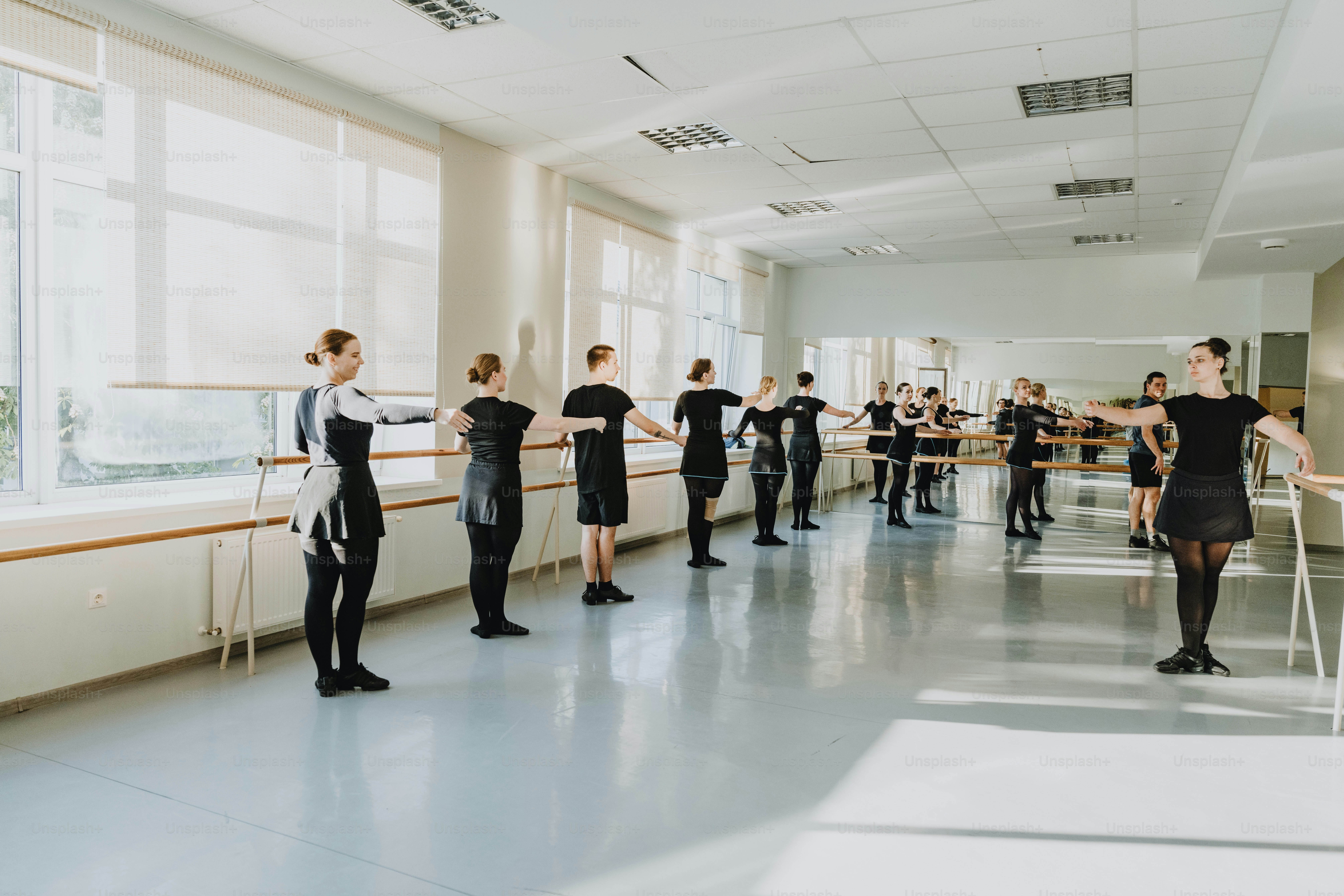 A group of people standing in a room photo – Dance Image on Unsplash