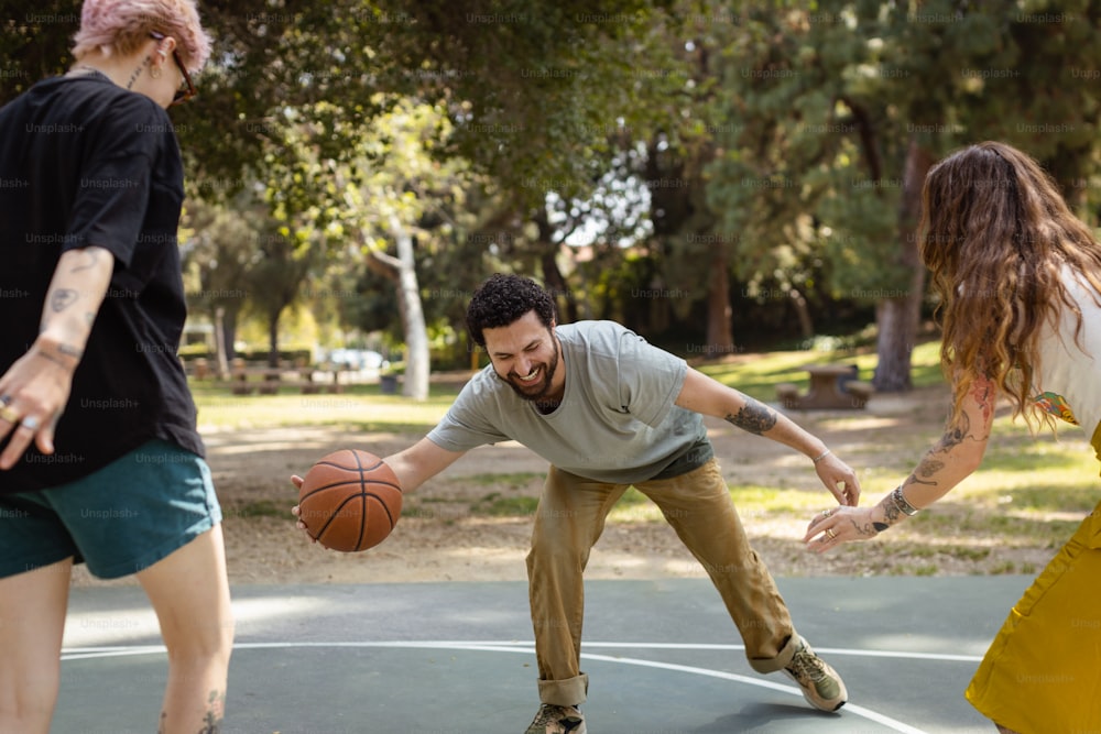 a man is playing basketball with a woman
