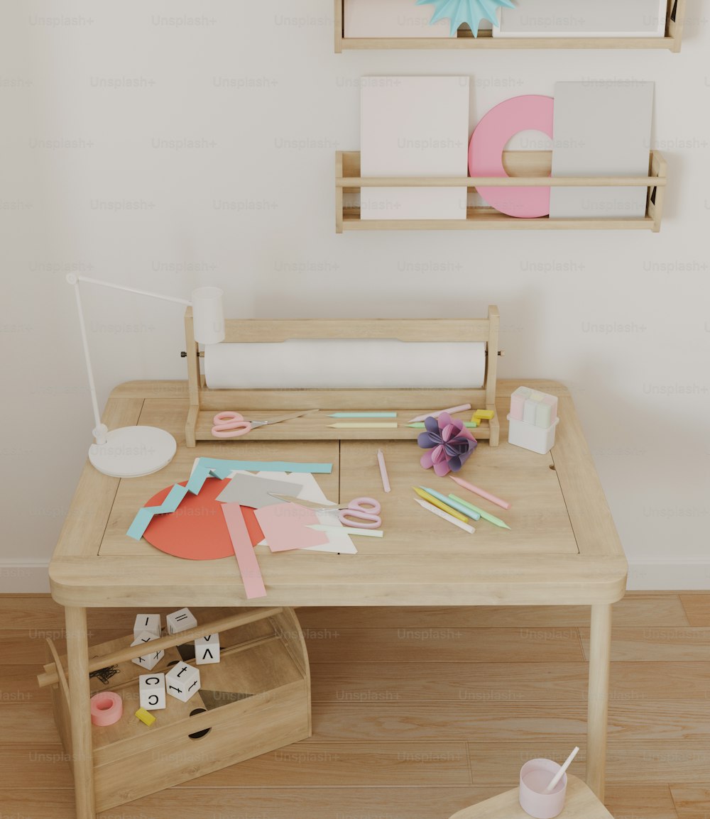 a wooden desk with craft supplies on it