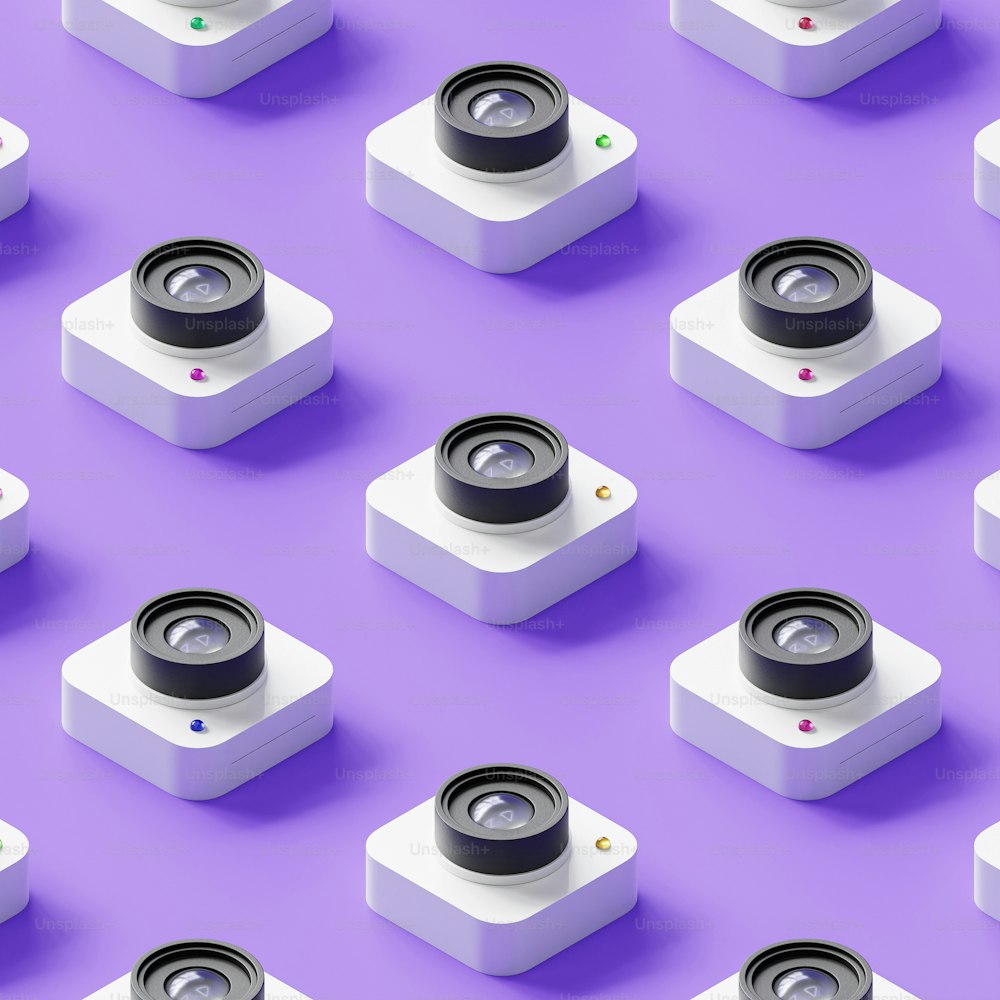 a group of cameras sitting on top of a purple surface