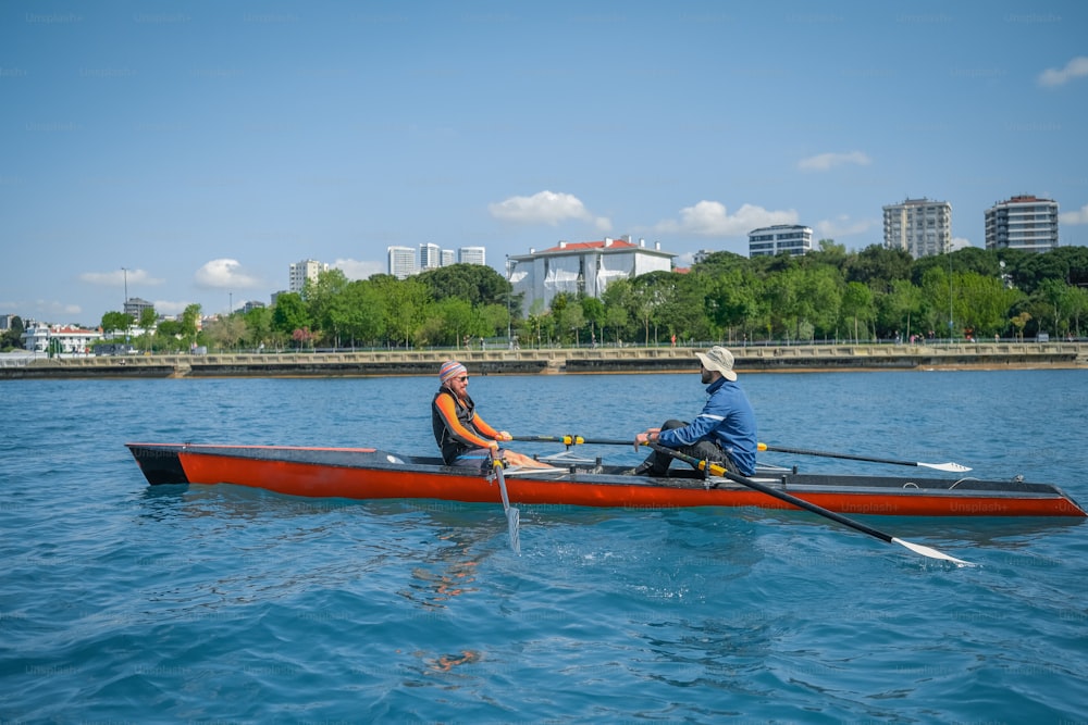 two people in a boat on a body of water