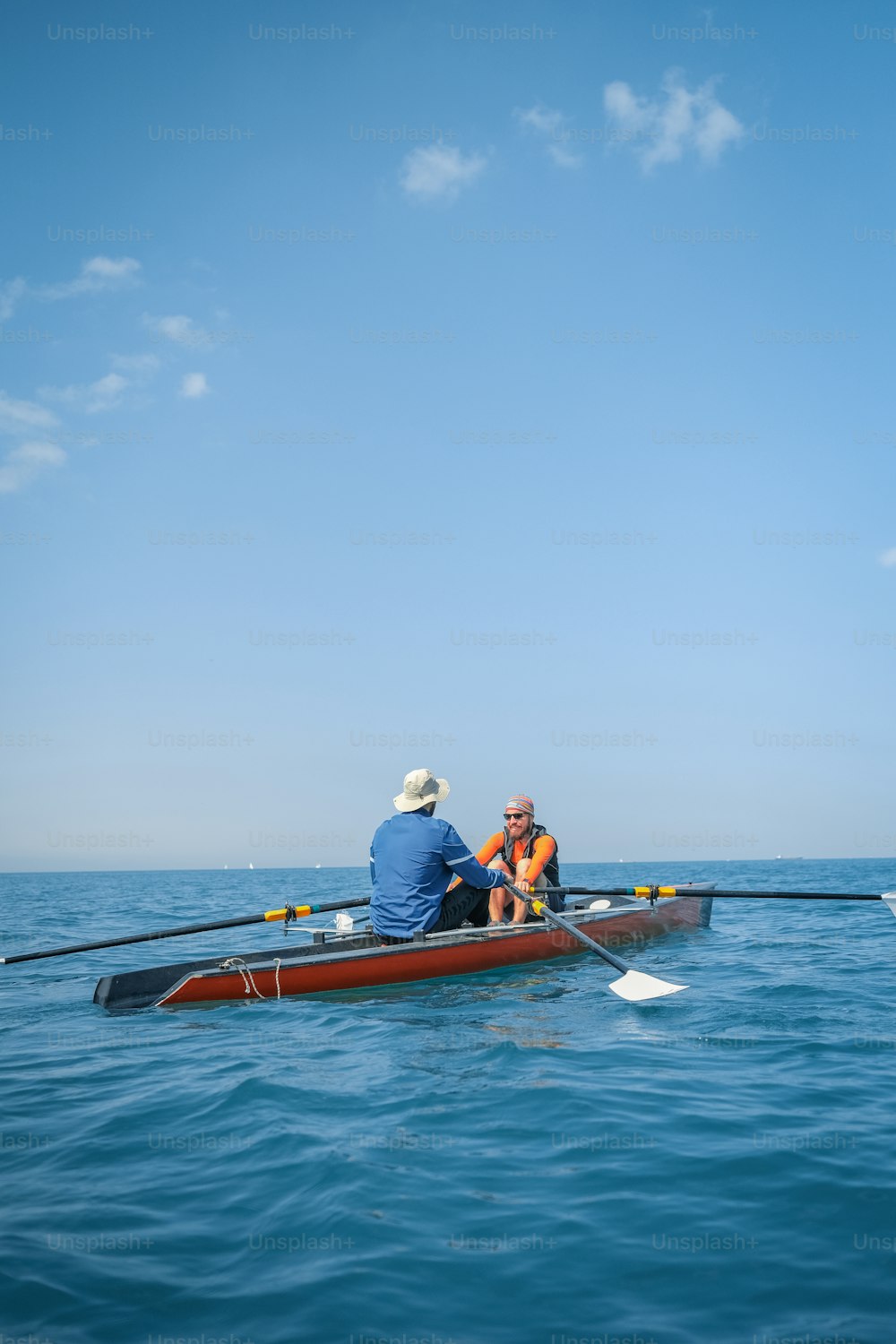 two people in a boat on the water