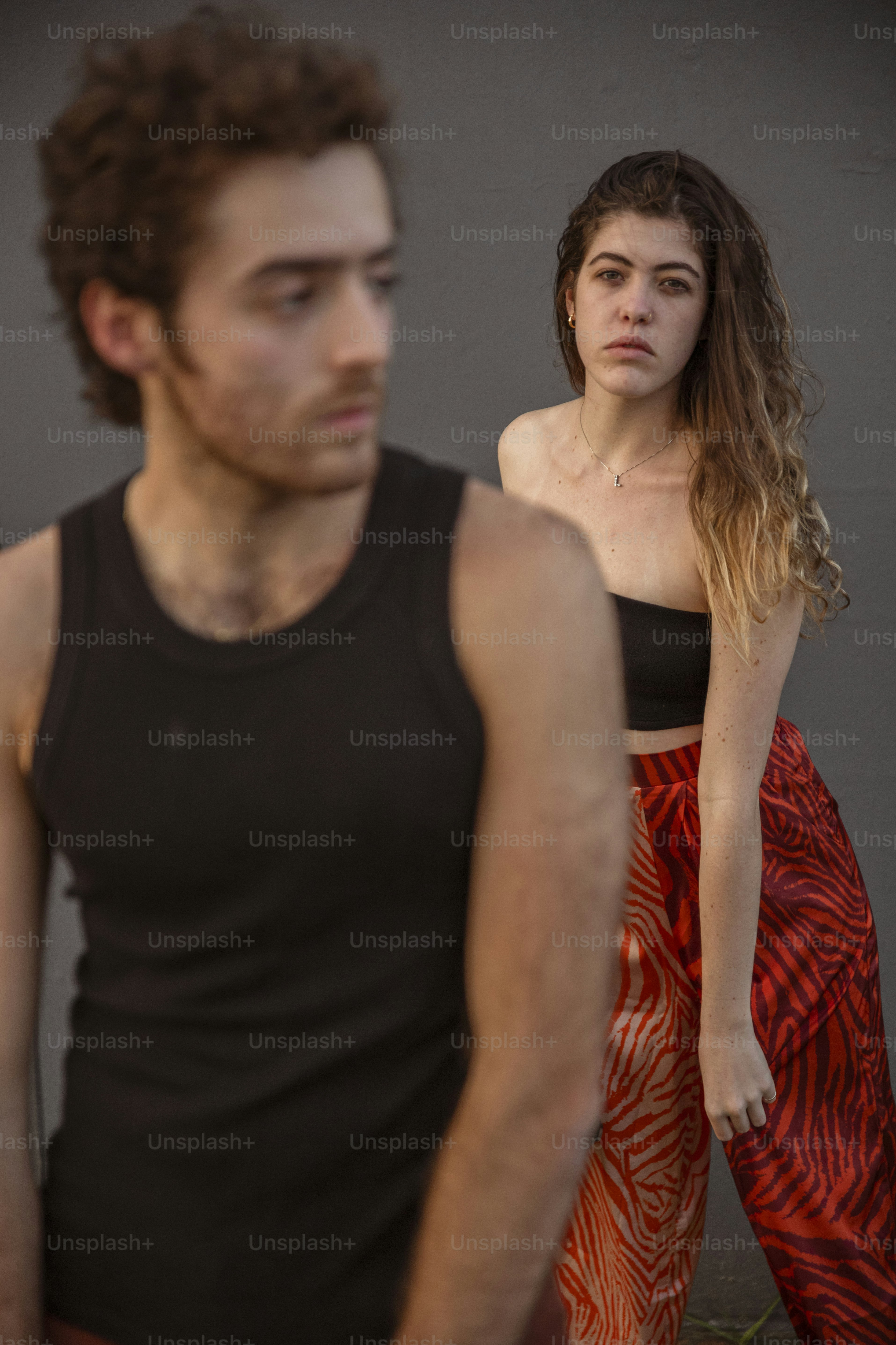 A man and a woman standing next to each other photo – Queer Image on ...