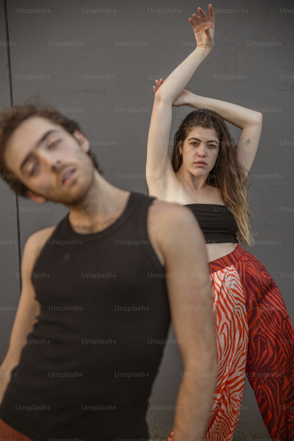 a man and a woman standing next to each other