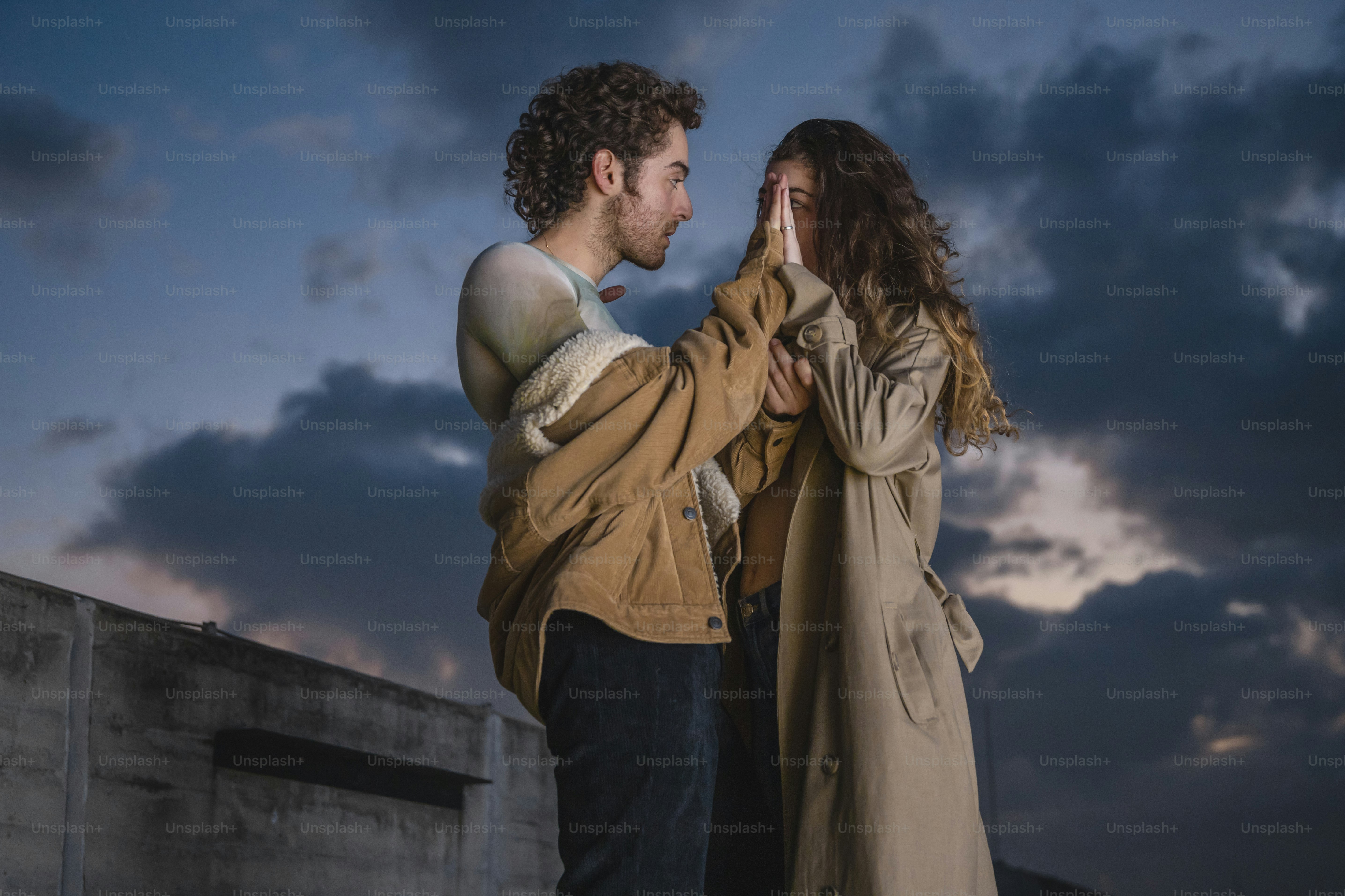 A man and a woman standing next to each other photo – Community Image ...