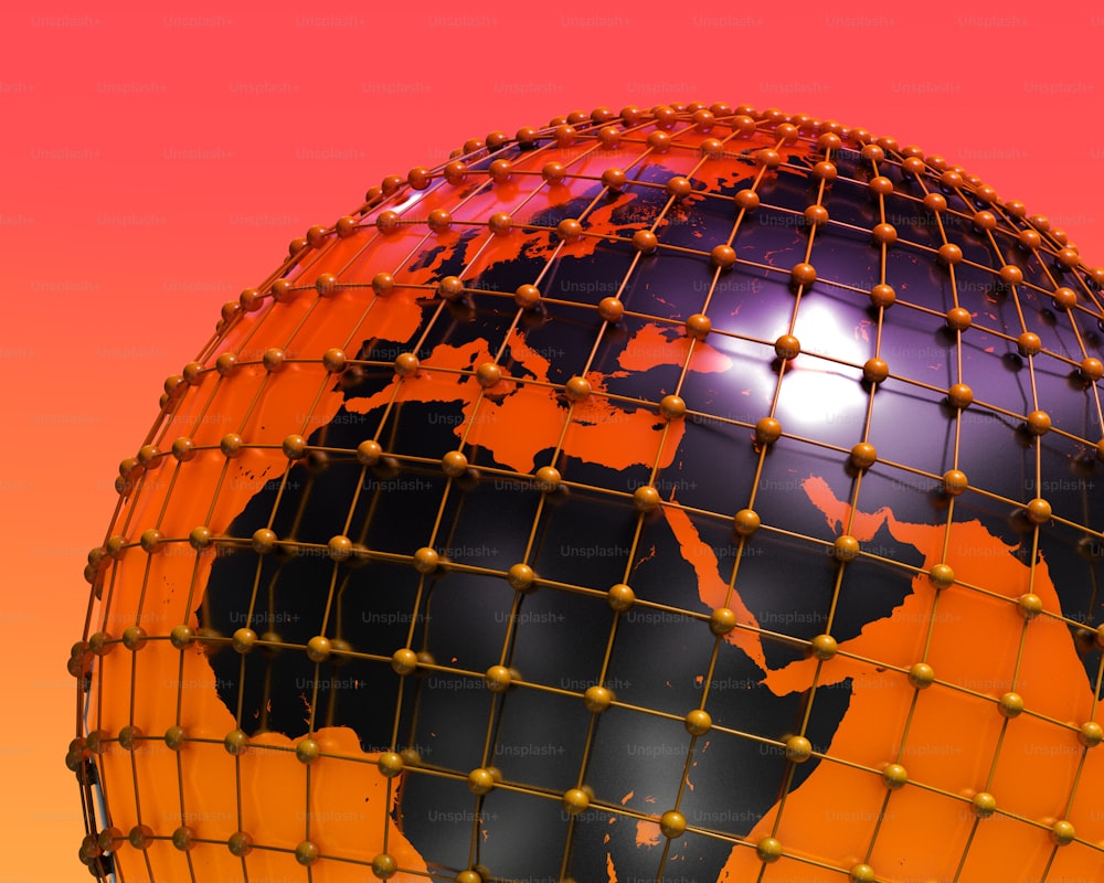 an orange and black globe with a red background