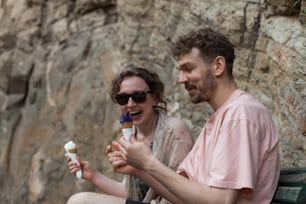 a man and a woman sitting on a bench