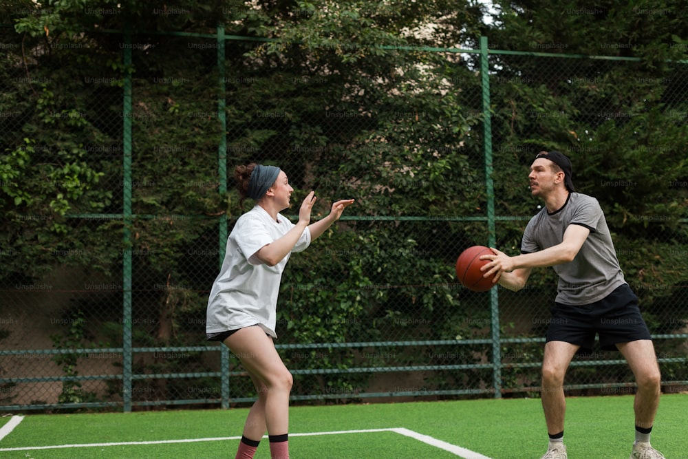 a man and a woman playing a game of frisbee