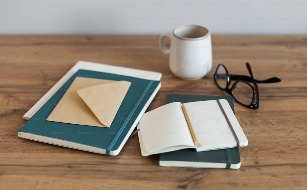 a cup of coffee and a notebook on a table