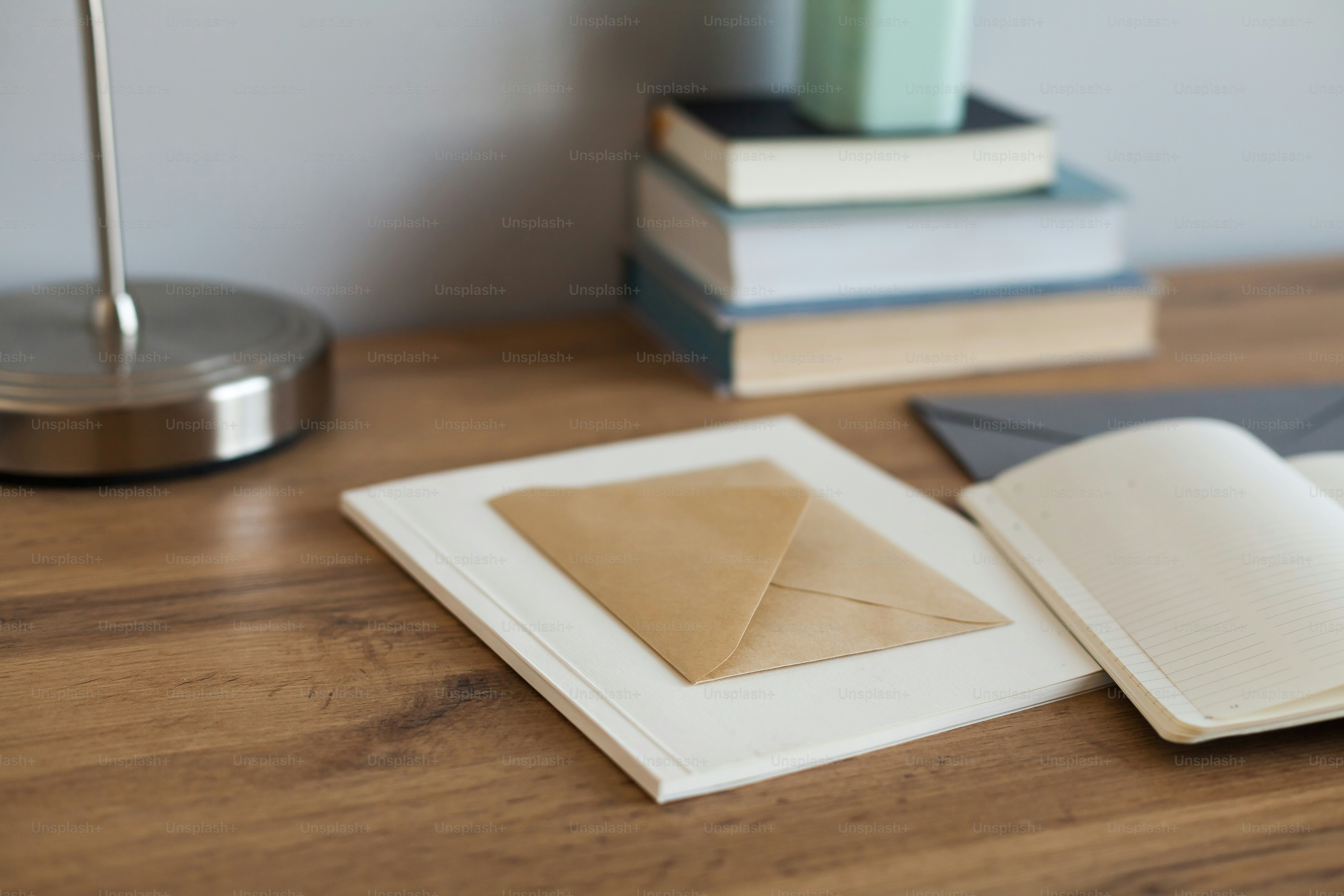 a stack of books sitting on top of a wooden table