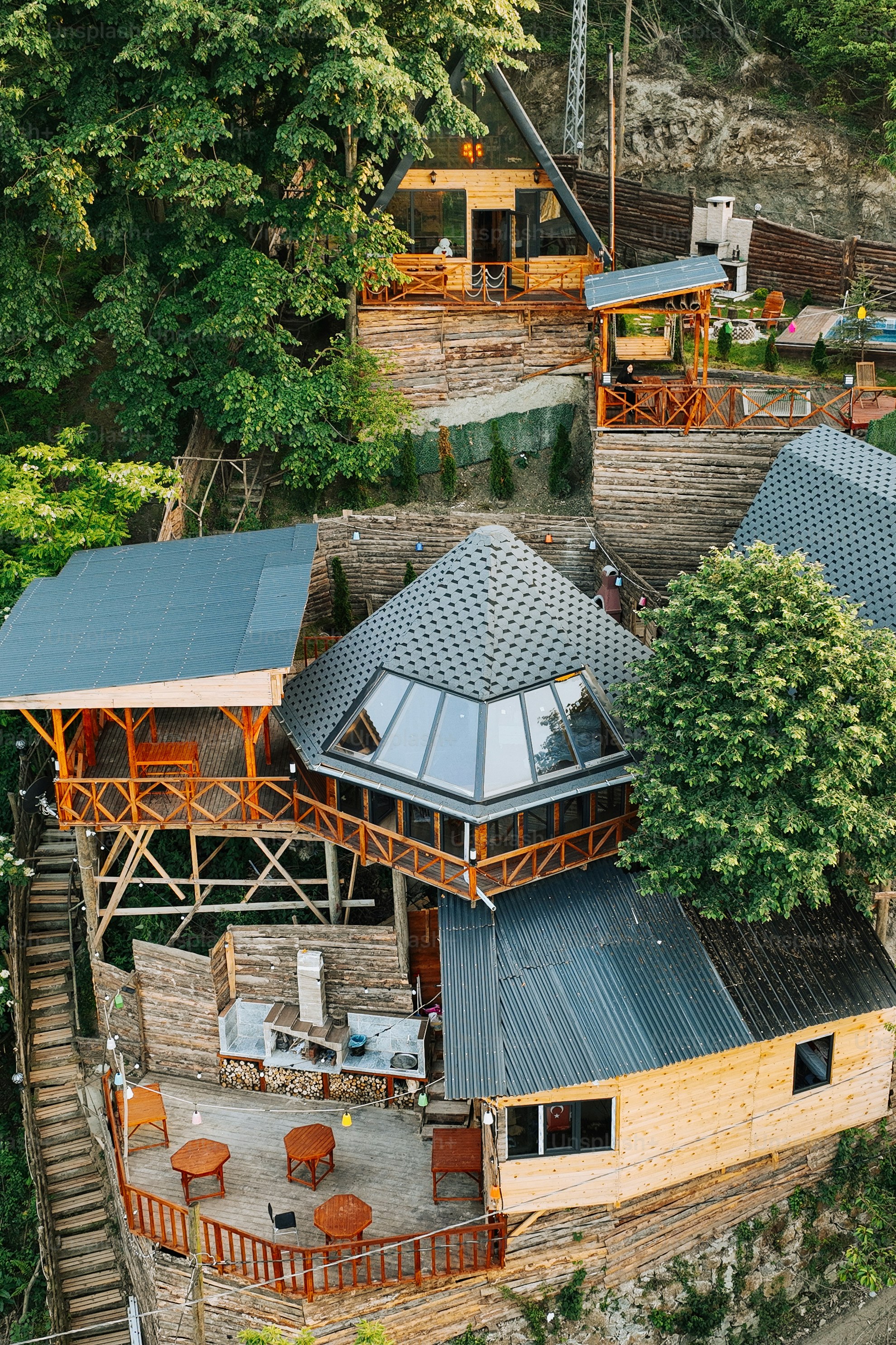 an aerial view of a house built into the side of a cliff