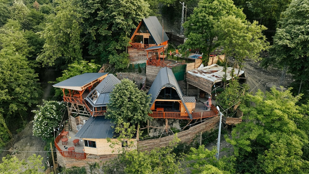 an aerial view of a house surrounded by trees