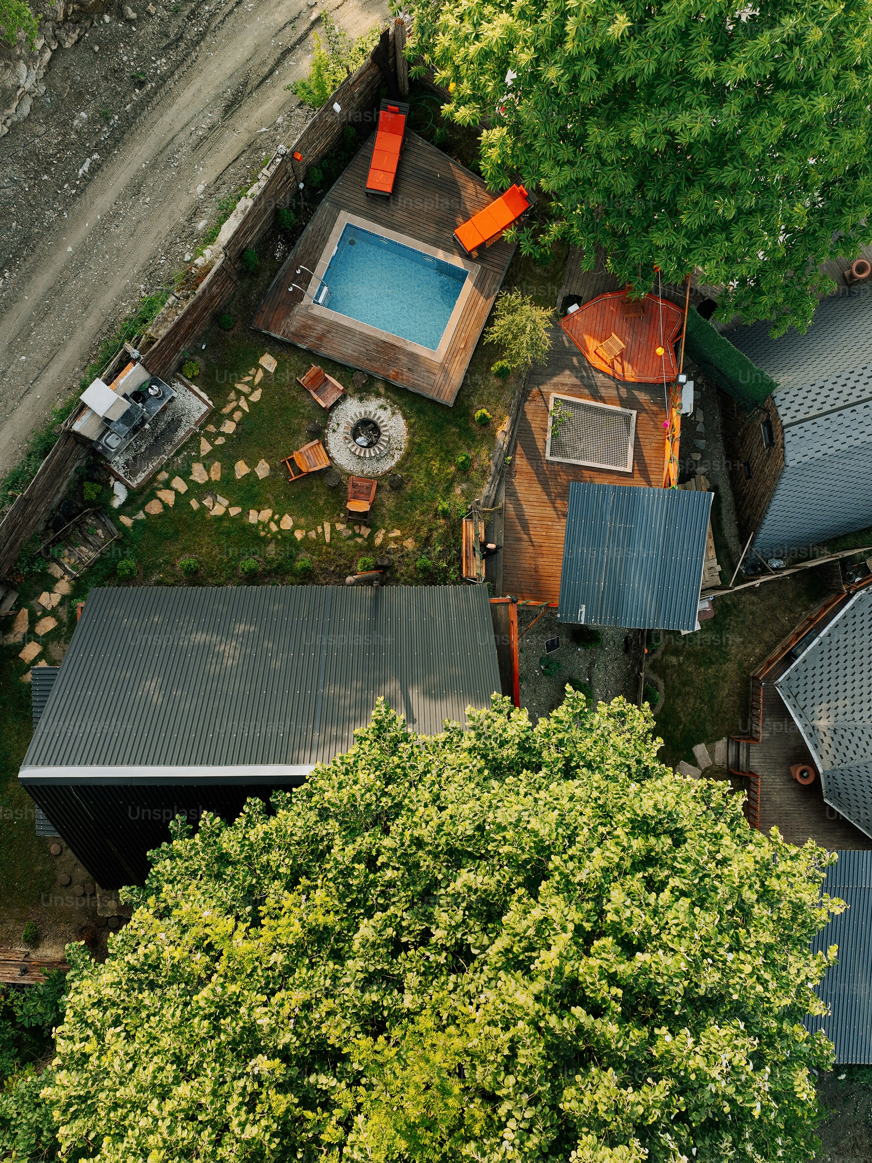 an aerial view of a house with a swimming pool