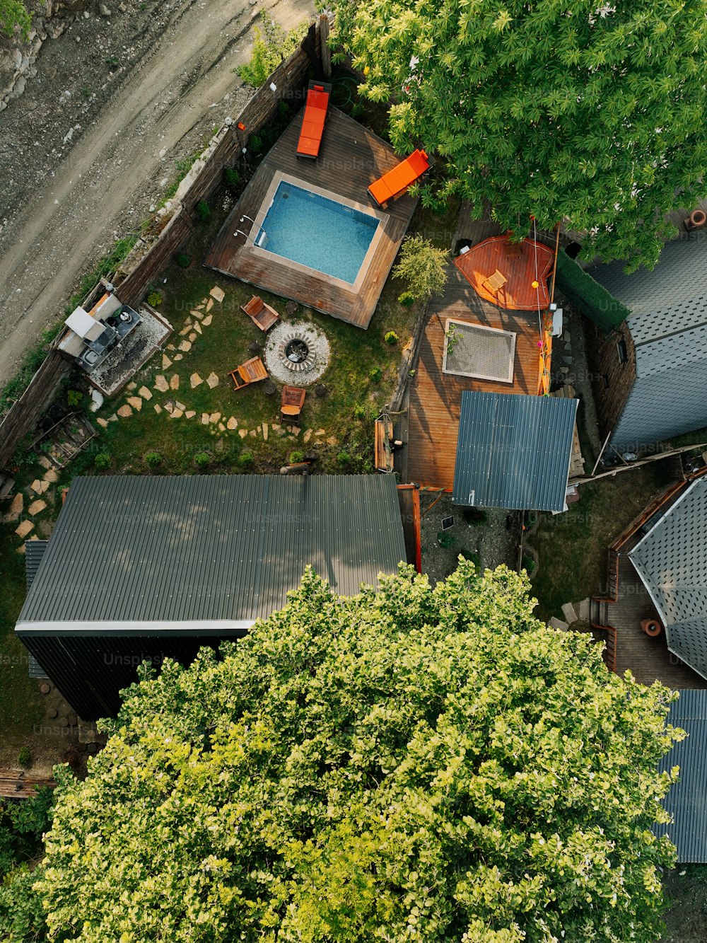 an aerial view of a house with a swimming pool