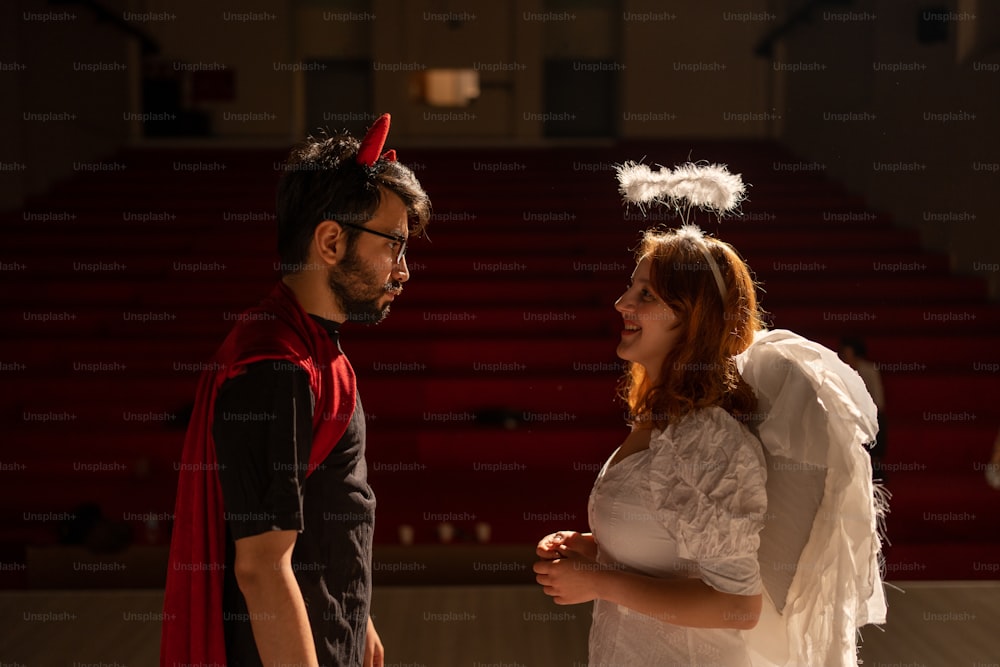 a man and a woman dressed up in costumes