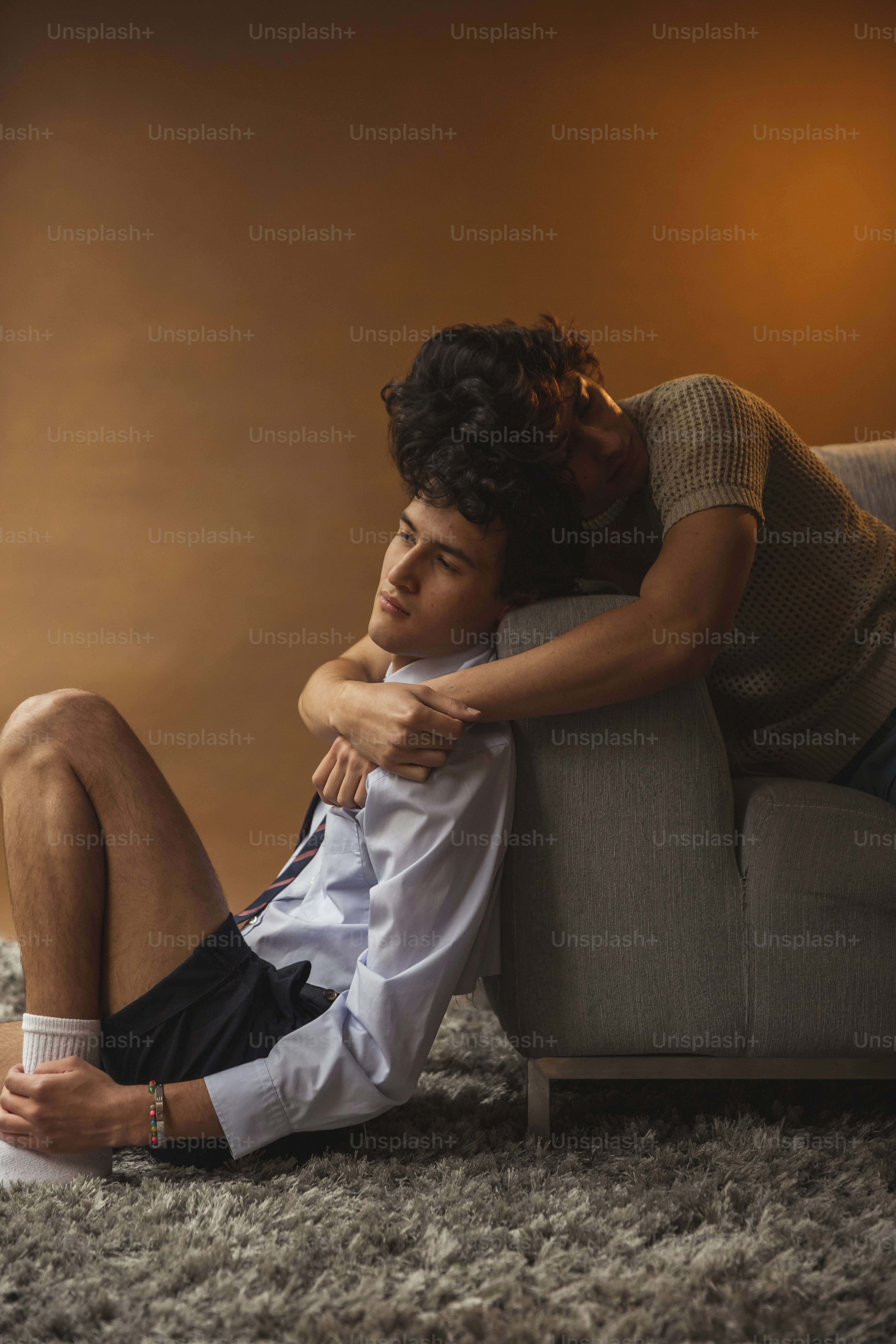 a couple of people that are sitting on a couch