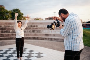 a man and a woman standing on a checkered floor