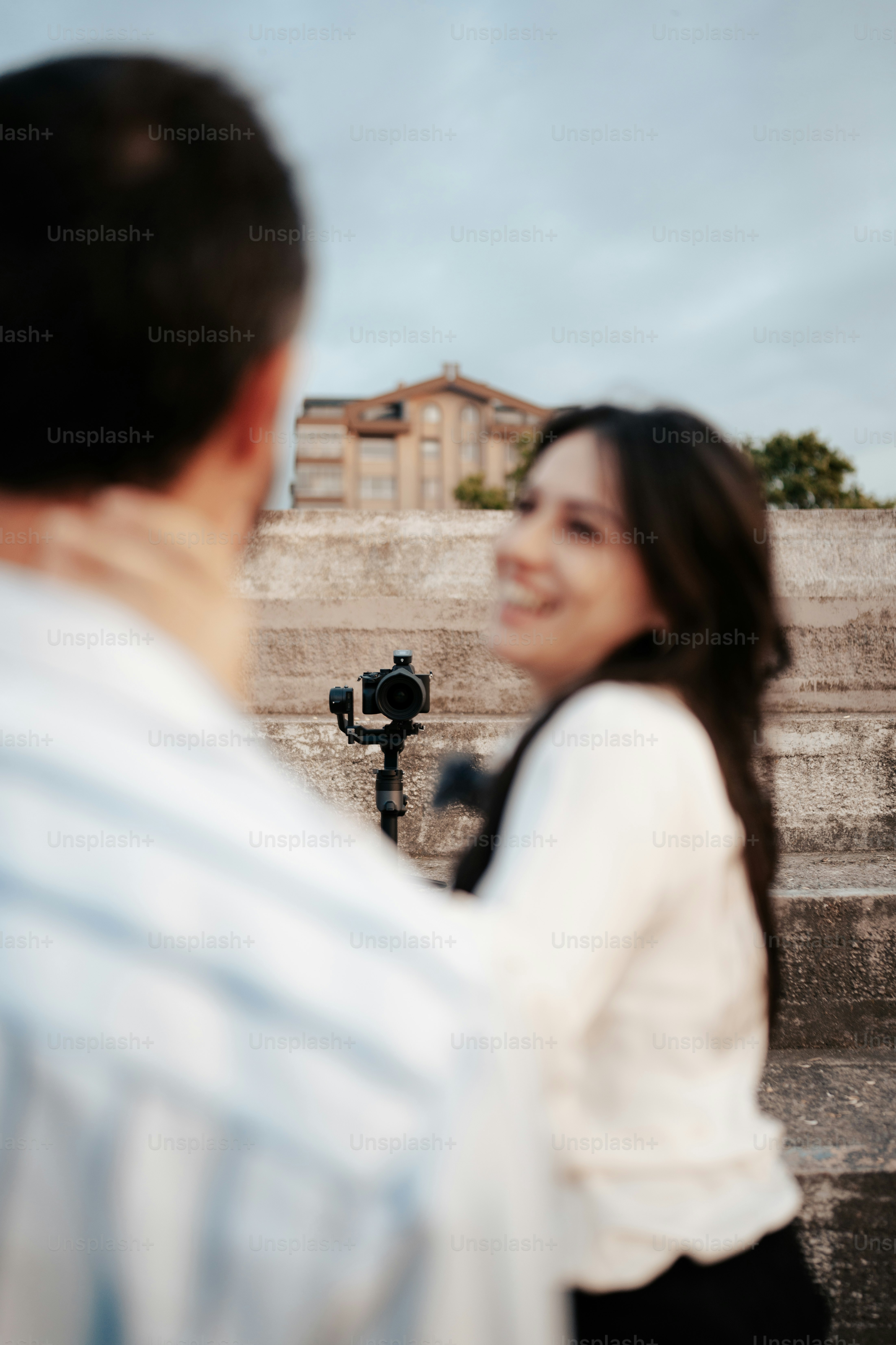 a man and a woman standing next to each other