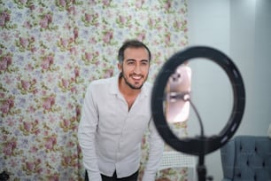 a man standing in front of a mirror in a room