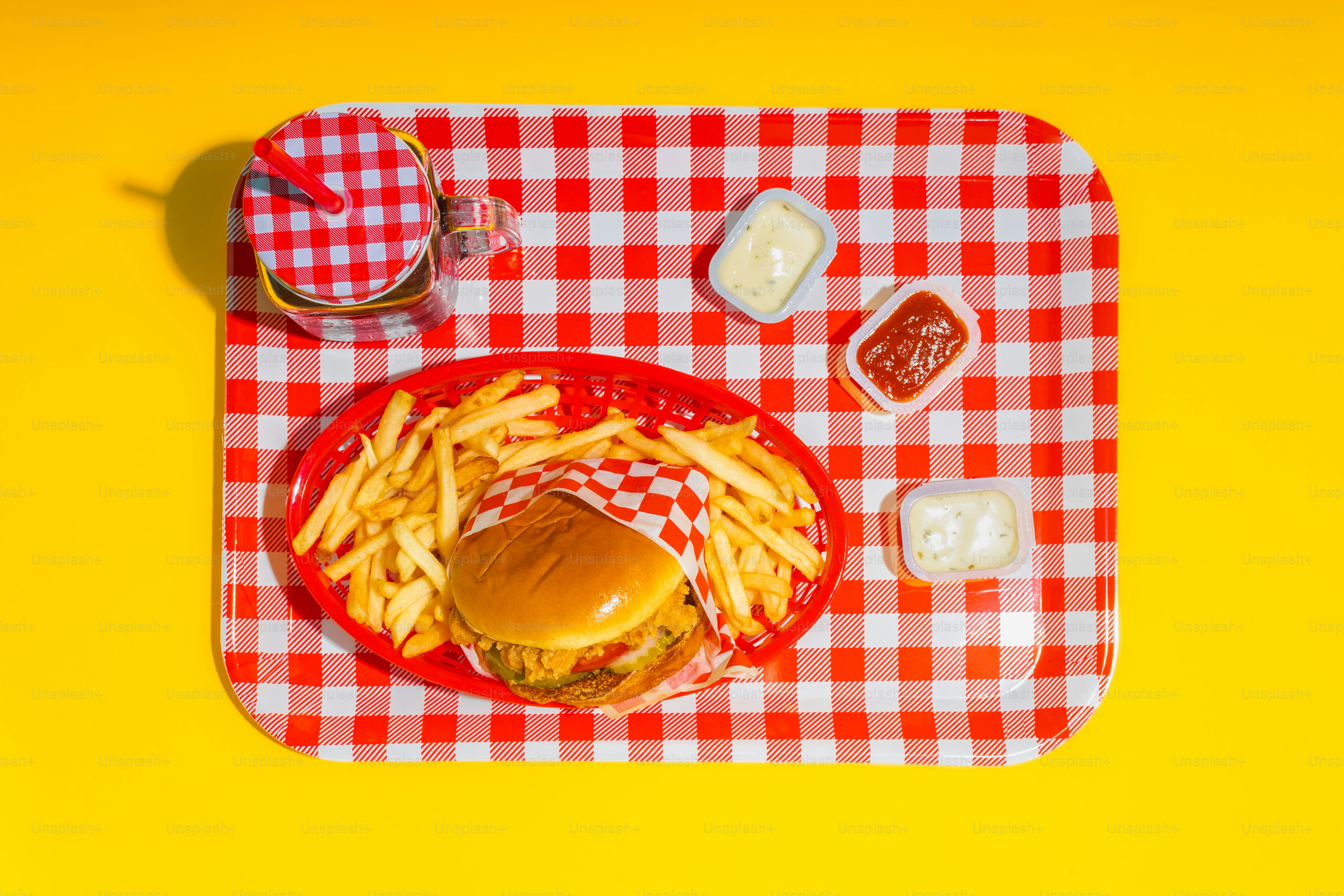 a tray with a hamburger and fries on it